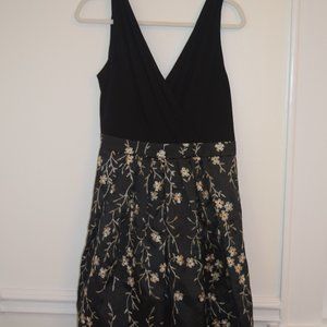 Black cocktail dress w/ gold flower detail